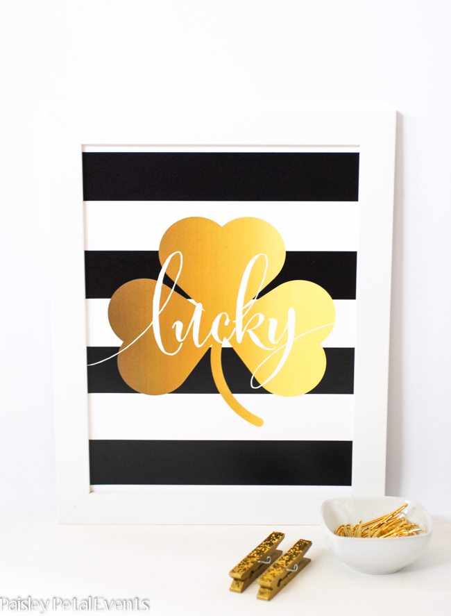 Free printable St. Patrick's day art print - black & white stripes with gold foil clover.