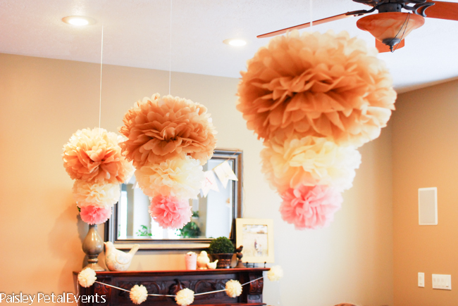 Large tissue poms which hang over the activity table