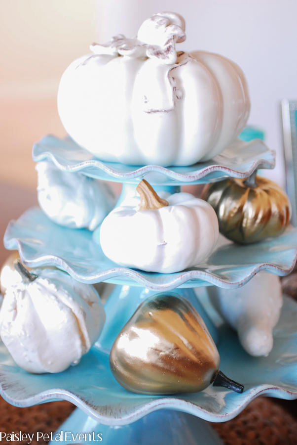 White and gold pumpkins on aqua cake stands