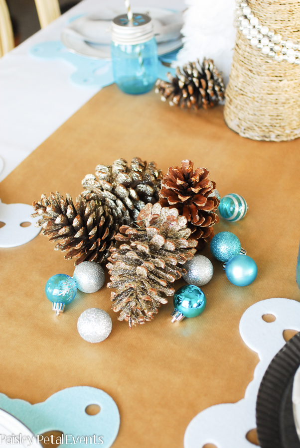 Shop your home for easy holiday entertaining. Pinecones and ornaments can easily be added to your holiday table.