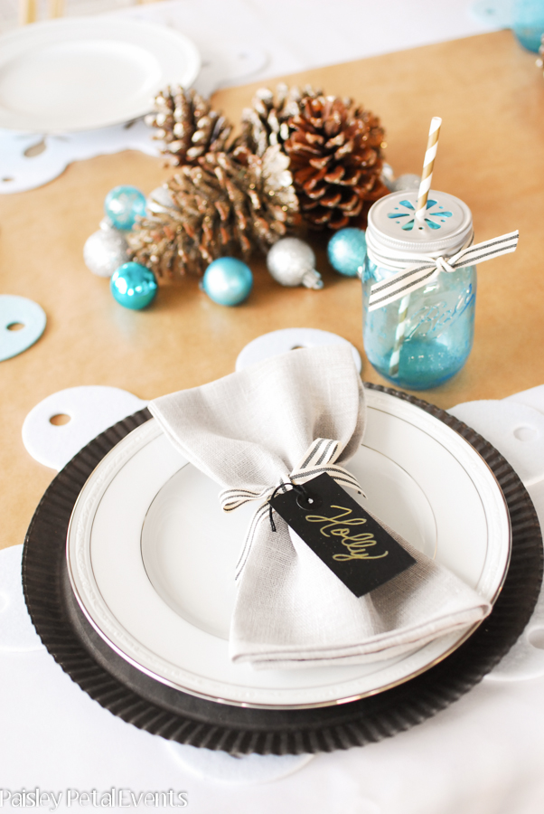 Use simple tags with gold handwritten names as namecards for your holiday table.