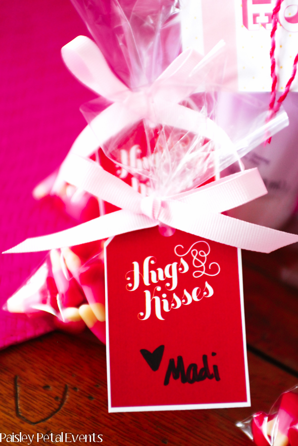 Red hugs and kisses hanging tag easily attaches to little Valentine's Day treats