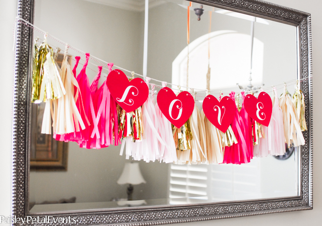 Red hearts LOVE banner for Valentine's Day decor. Print the PDF at home, cut out the hearts, string with ribbon and hang!
