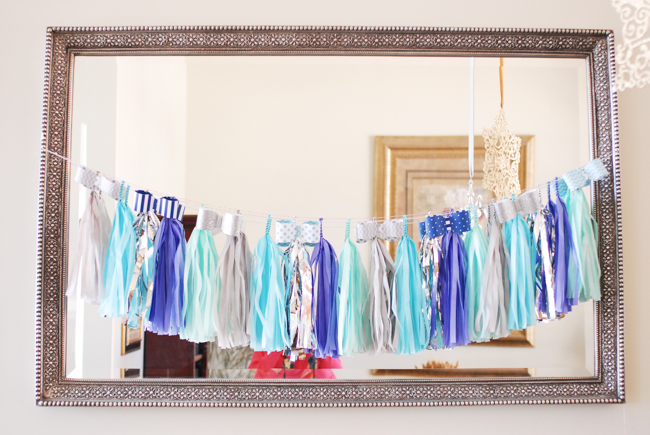 Caribbean blue tissue tassel garland and DIY paper bowtie garland for a boy baby shower